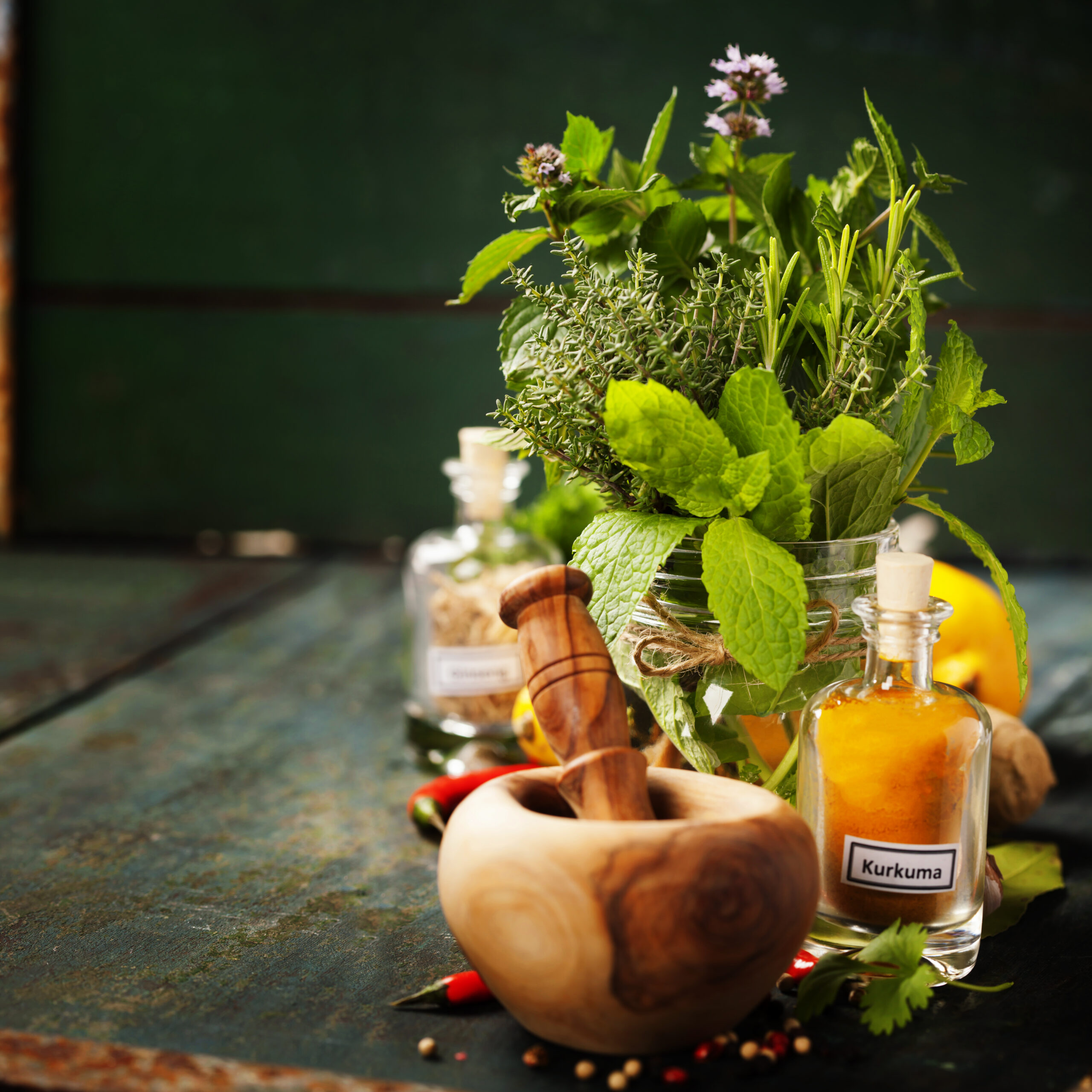 Herbs and spices with Mortar and Pestle on wooden background